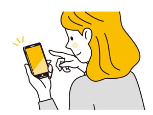 スマホをいじる女性